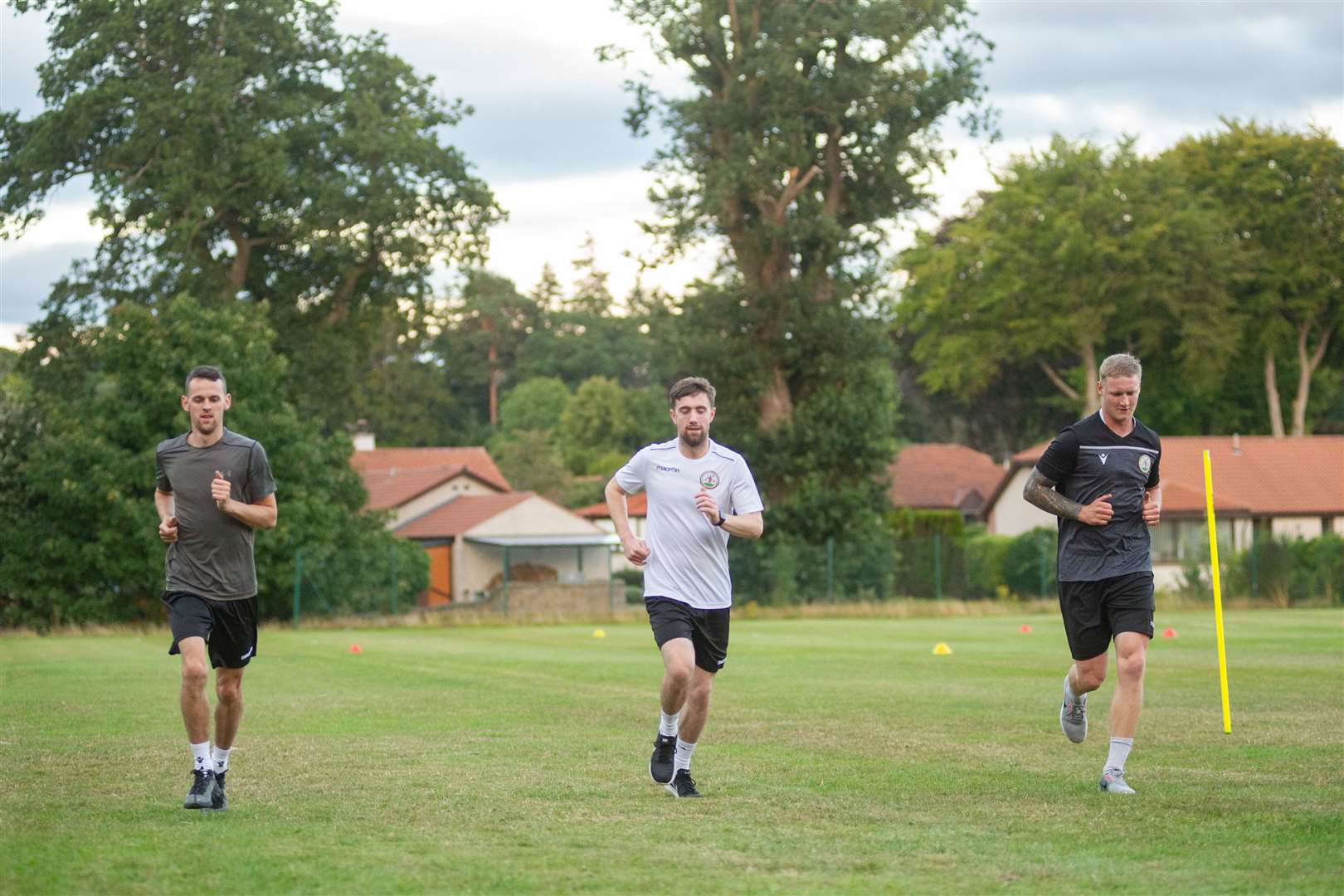 Ryan Farquhar, Scott Miller and Graham Fraser get up to fitness on the Forres Mechanics training ground. Picture: Daniel Forsyth..