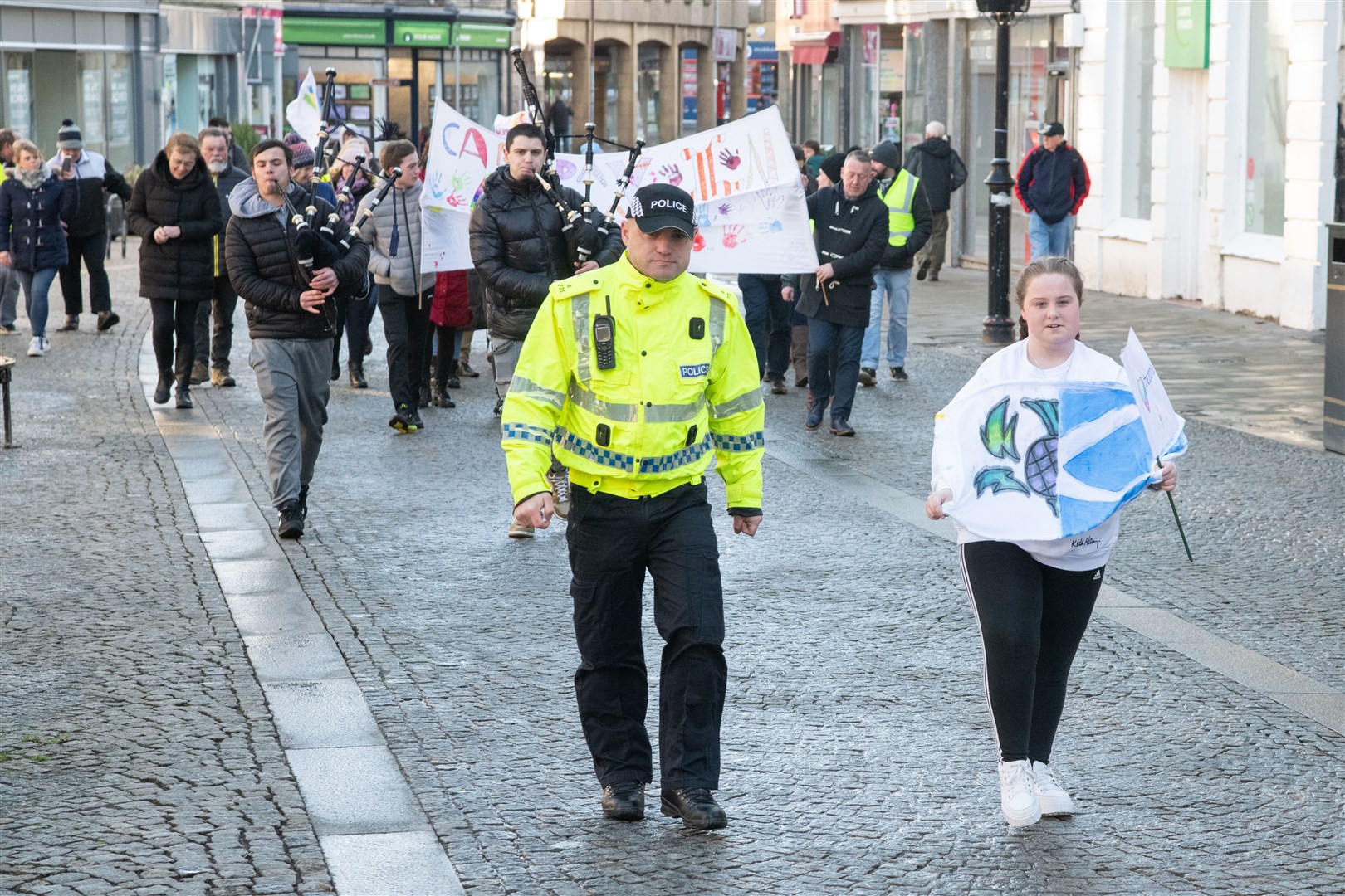 They marched from the Council HQ, around the Plainstones and then back to the HQ...Moray Council celebrate Care day - a national day of recognising and celebrating care experience. ..Picture: Daniel Forsyth..