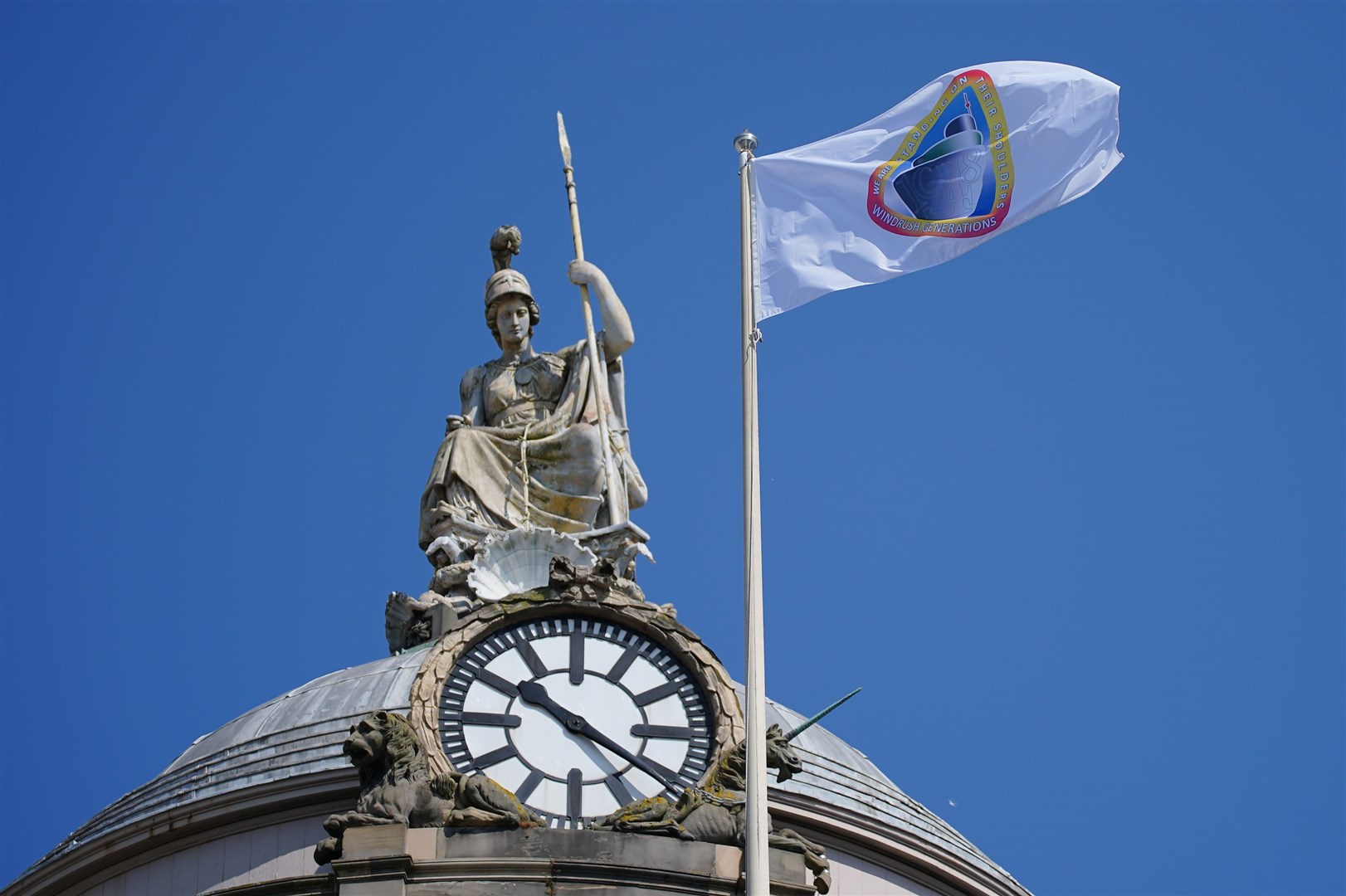 The Windrush flag over Liverpool Town Hall (Peter Byrne/PA)