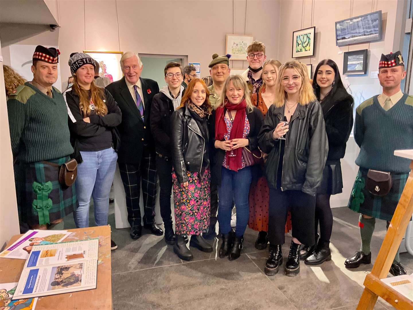 Lord Lieutenant of Moray, Major General Seymour Monro (3rd from left) opening the exhibition with featured artists and soldiers from Fort George who offered their support. Picture by Wendy Faux.