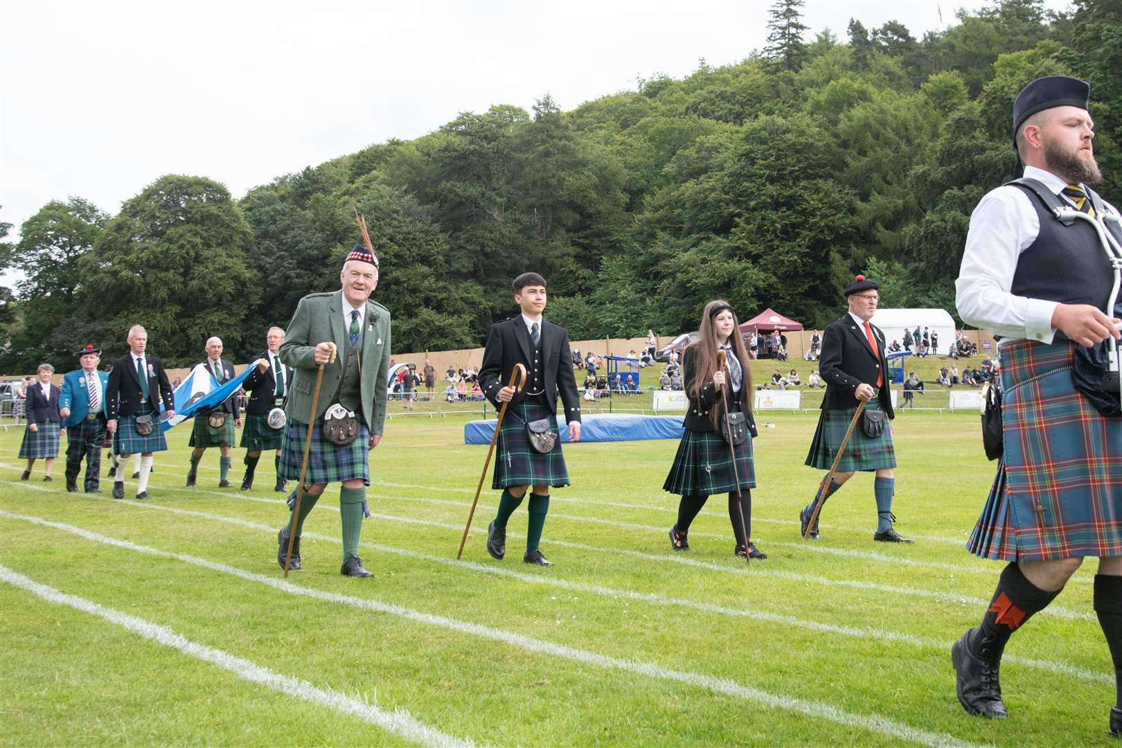 Opening parade with Chieftan of the Games George Alexander (centre left)...Forres Highland Games 2022...Picture: Daniel Forsyth..