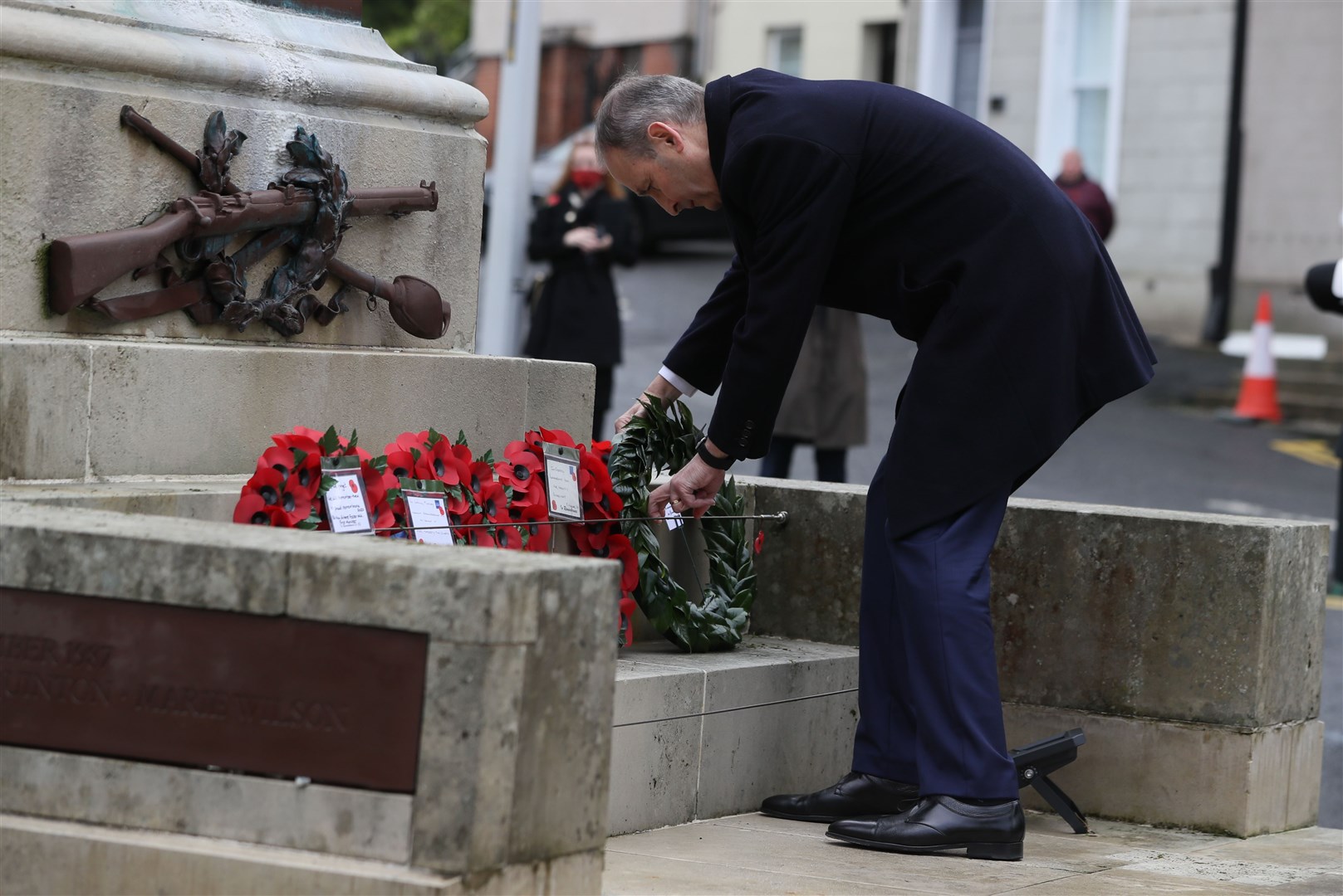 Irish Taoiseach Micheal Martin lays a wreath during the Remembrance Sunday service at the Cenotaph in Enniskillen (Brian Lawless/PA)