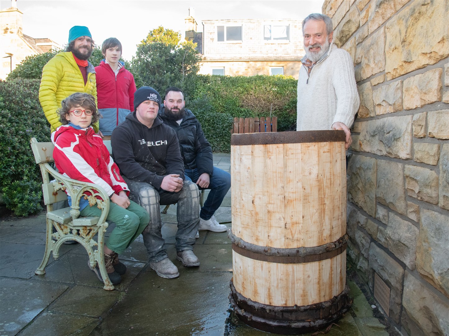 Part of the Clavie Crew with the barrel which will be set alight next Thursday evening. Picture: Daniel Forsyth.