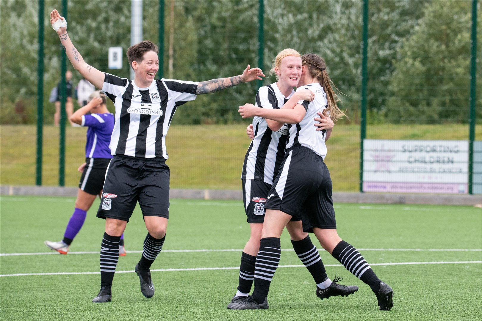 Elgin City's Abi Hayes (right) celebrates with Jess Moore and Lily Morrison after making it 2-1 to the home side in the first half. ..Elgin City (4) vs Buchan LFC (5) - SWFL North 23/24 - Gleaner Arena, Elgin 17/09/2023...Picture: Daniel Forsyth..
