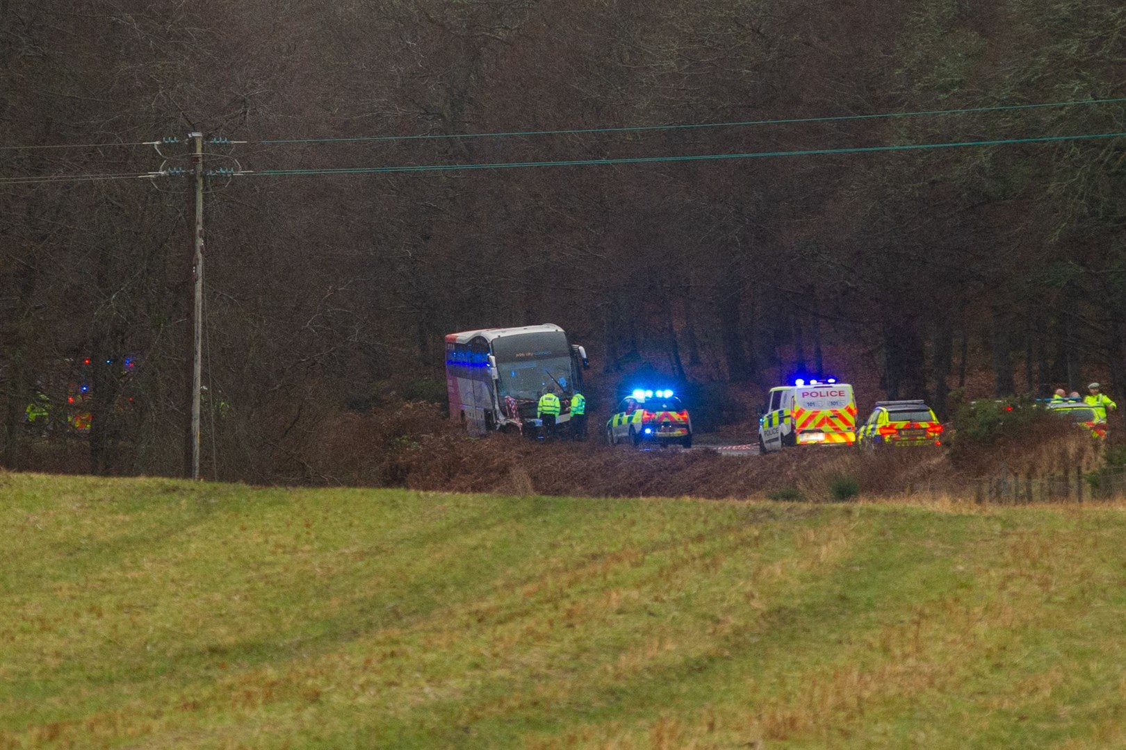 Emergency services at the scene of a bus crash on the A96 west of Elgin. Picture: Highland News & Media Photographer.