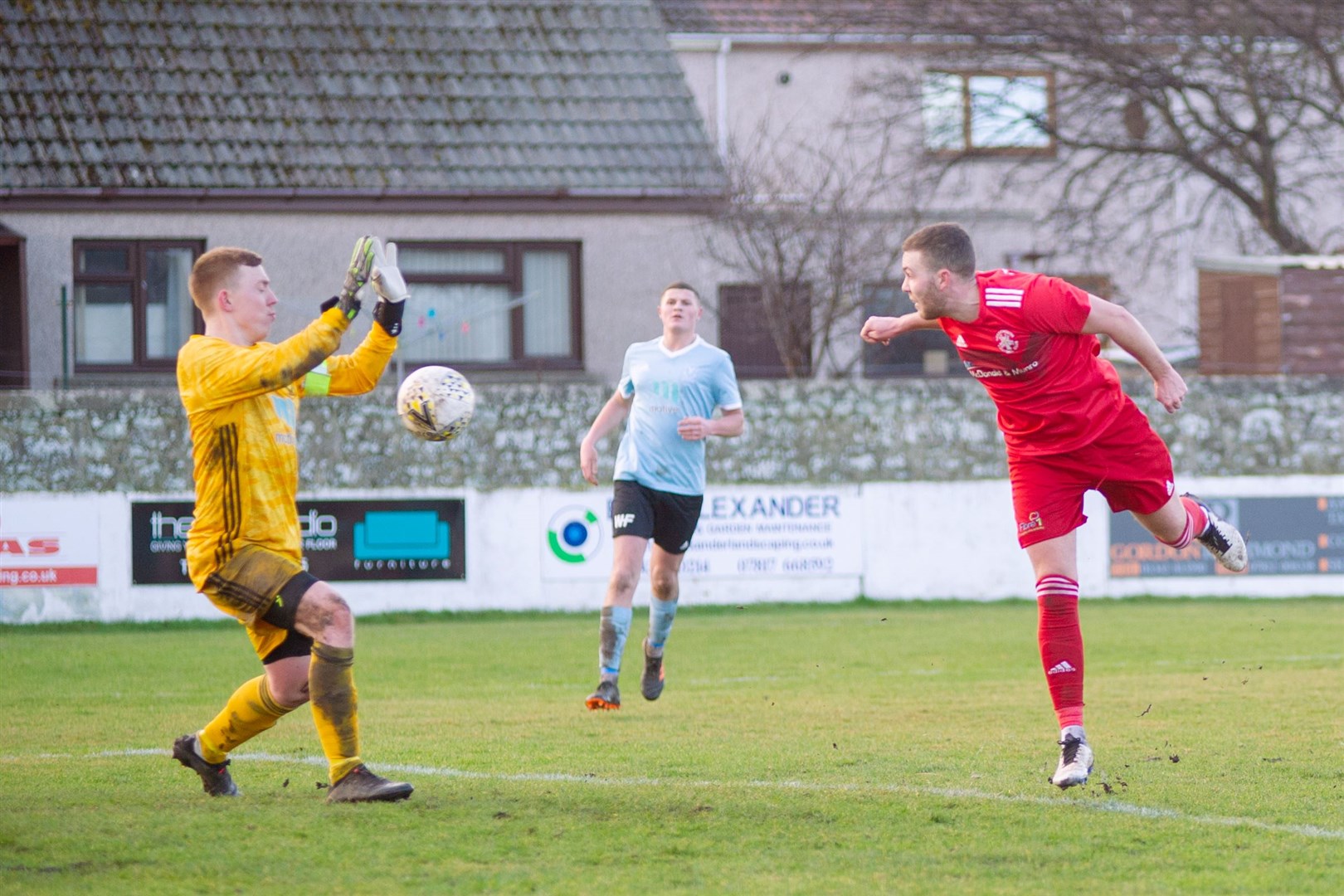 Lossie's Ryan Stuart is unable to make this chance count past Deveronvale keeper Sean Mcintosh. Picture: Daniel Forsyth.