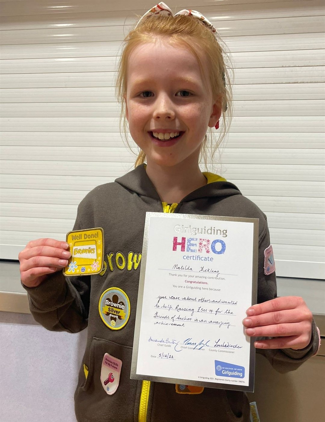Matilda Fickling of 2nd New Elgin Brownies with her award.