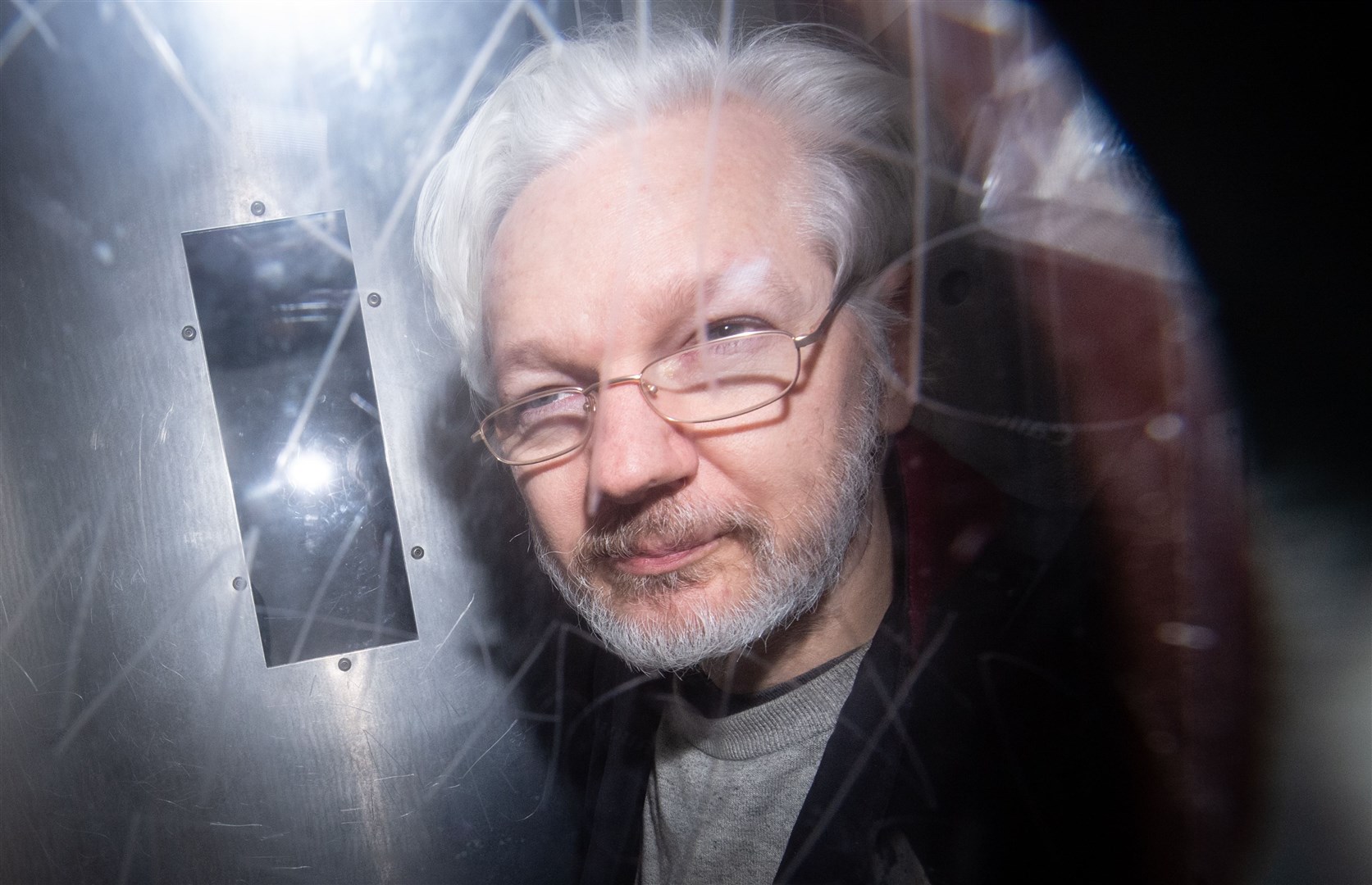 Julian Assange leaves court (Dominic Lipinski/PA)