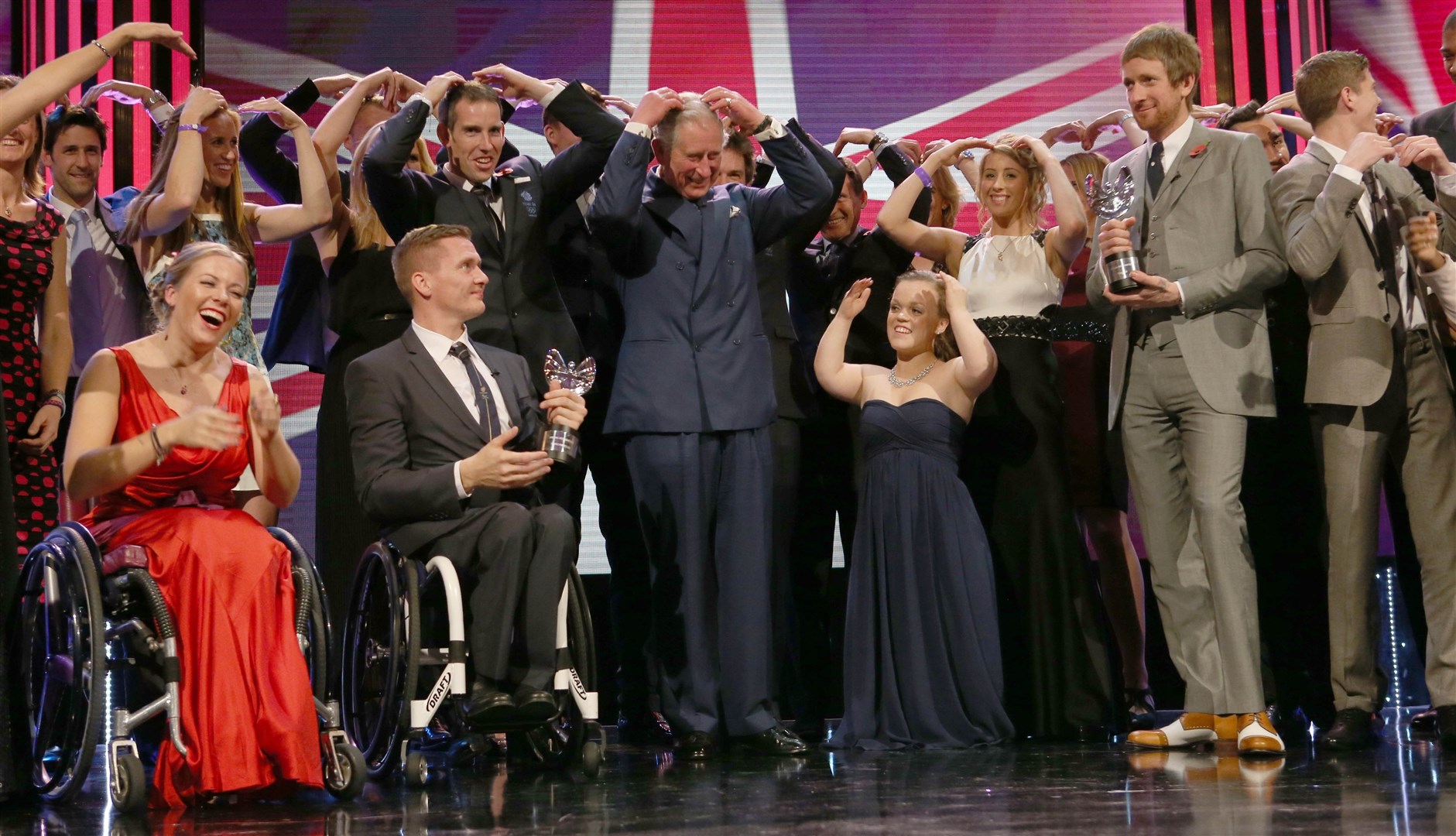 Charles with members of Team GB and Paralympic GB doing the ‘Mobot’ at the Pride of Britain Awards in 2012 (Ian Vogler/Daily Mirror/PA)