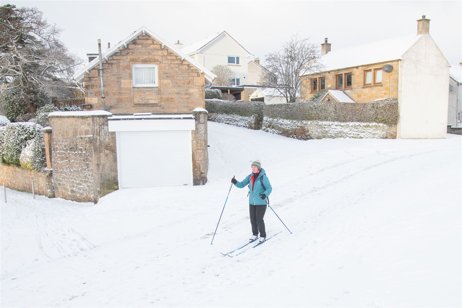 A skier makes her way around the frosted streets of Brodie Drive in Bishopmill this morning. Picture: Daniel Forsyth