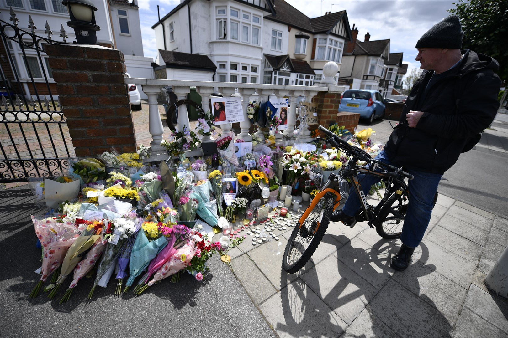Flowers are left after the vigil (Beresford Hodge/PA)