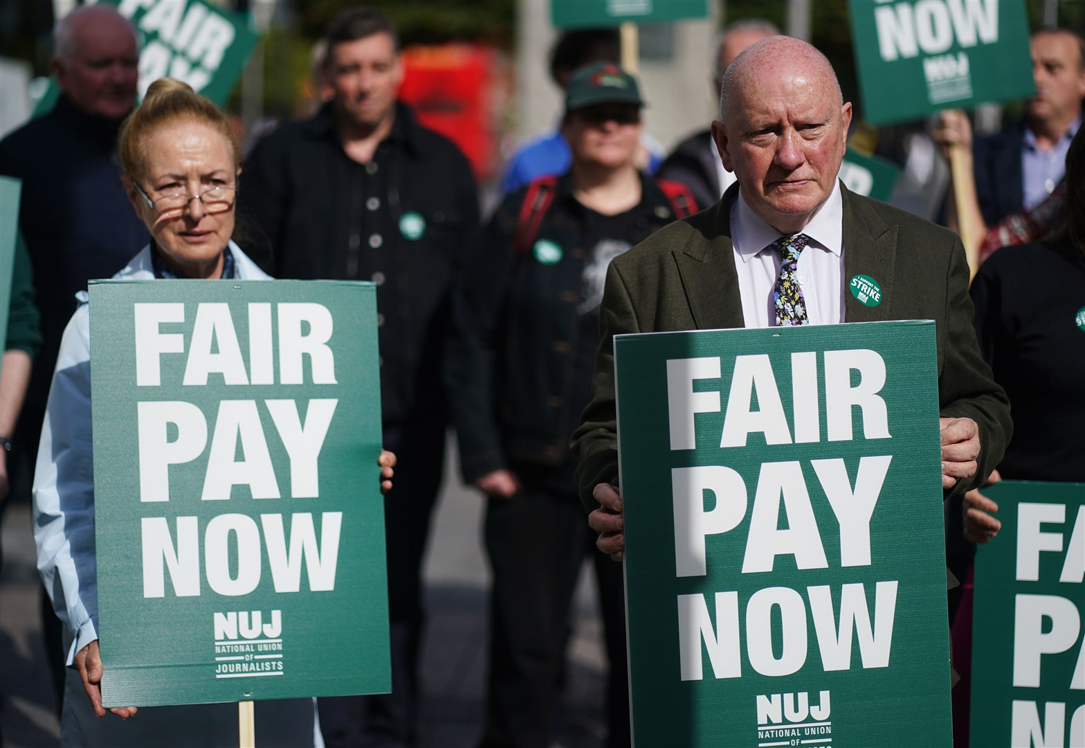Seamus Dooley (right), NUJ Irish secretary, with members of the National Union of Journalists and supporters on O’Connell Street (Brian Lawless/PA)
