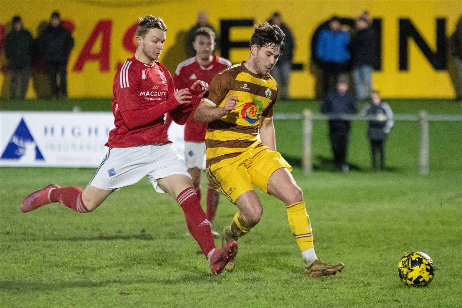 Vale's Rogan Reed moves in to win the ball from Forres' Thomas Brady...Forres Mechanics FC (0) vs Deveronvale FC (2) - Highland Football League 23/24 - Mosset Park, Forres 13/01/2024...Picture: Daniel Forsyth..