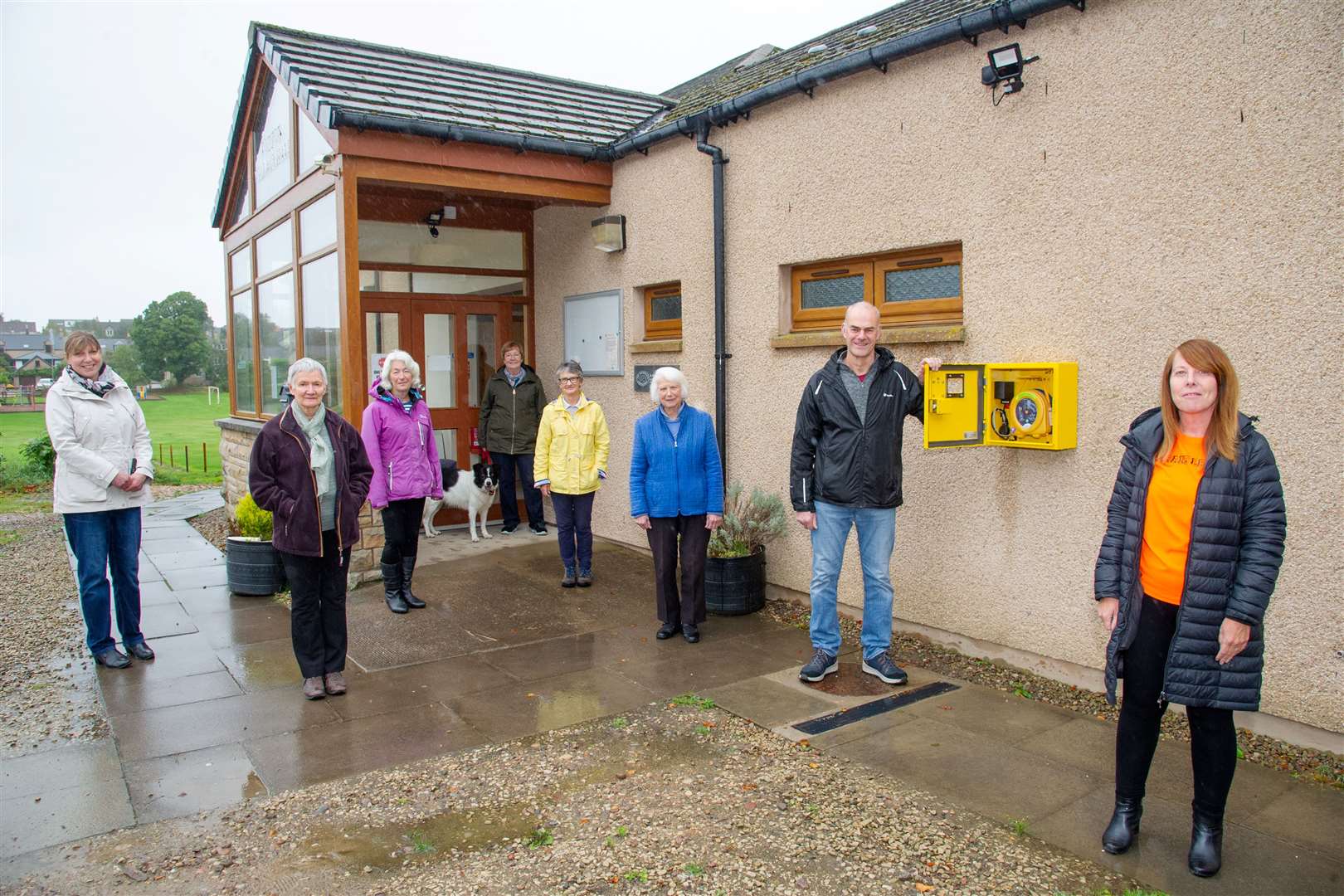 Sandra McKandie (right) joins Duffus Village Hall committee members and hall users as they accept their new defibrillator...Picture: Daniel Forsyth