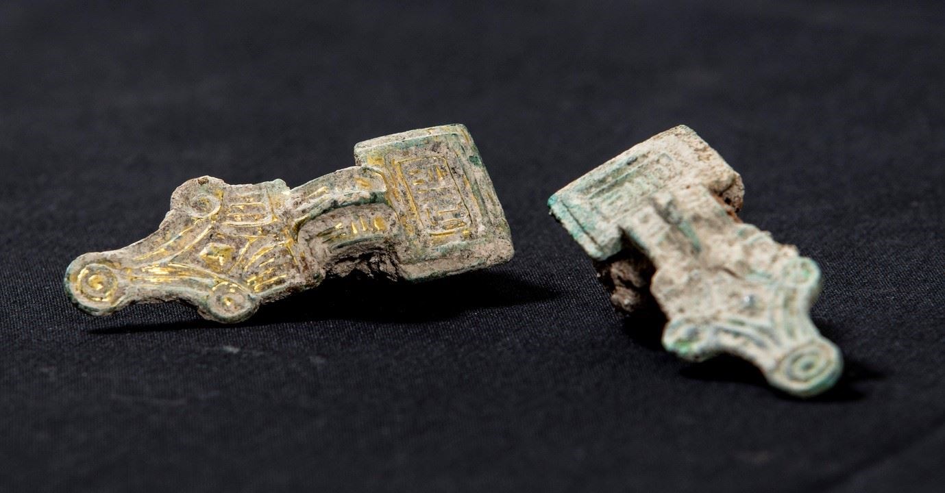 A set of copper alloy small square headed brooches, decorated with gold gilt, from the 5th or 6th century, uncovered during HS2 archaeological work in Wendover (HS2 Ltd)