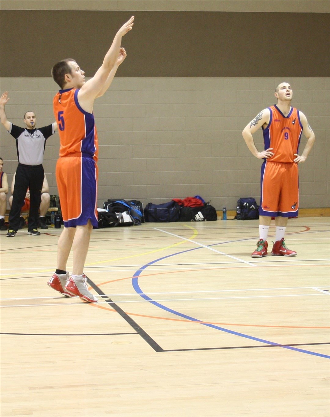 Moray Mavericks coach and secretary Graham Stewart in action, watched on by Jamie Alexander.
