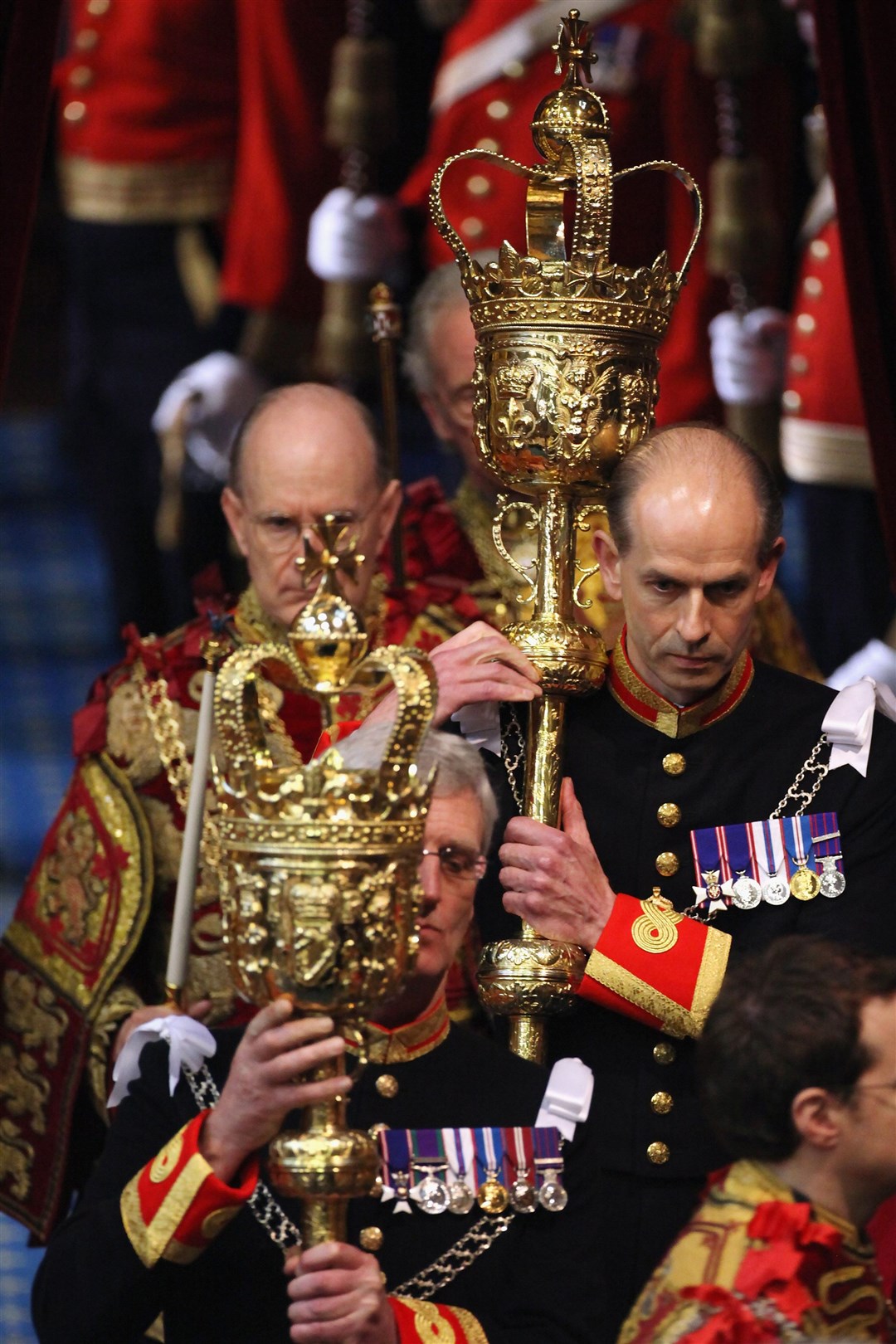 Guardsmen carry ceremonial maces into the House of Lords at the State Opening of Parliament in 2012 (Oli Scarff/PA)