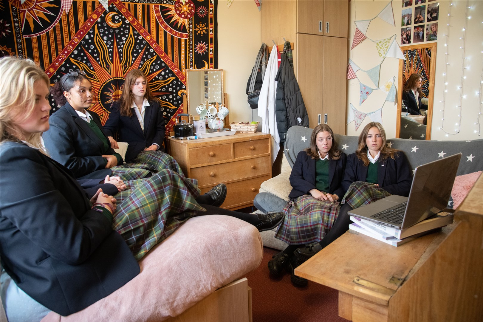A small group of girls gathered in King Charles' former dormitory to watch the funeral. Picture: Daniel Forsyth