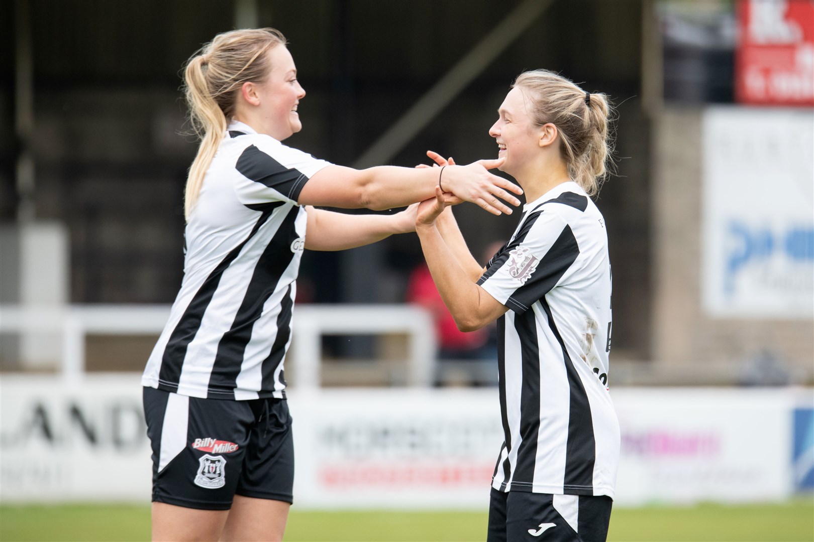Elgin City's Sarah Westwood (right) celebrates her opener with Charlotte Worthing.Elgin City Women (5) vs Dyce Women FC (5) - SWFL North 2023/24 - Borough Briggs, Elgin 5/5/2024.Picture: Daniel Forsyth.