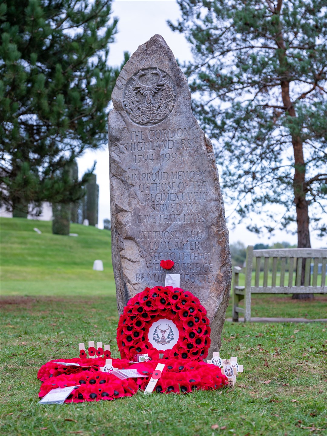 The new memorial with the poppy tributes laid at the unveiling. Pictures: James Finlay