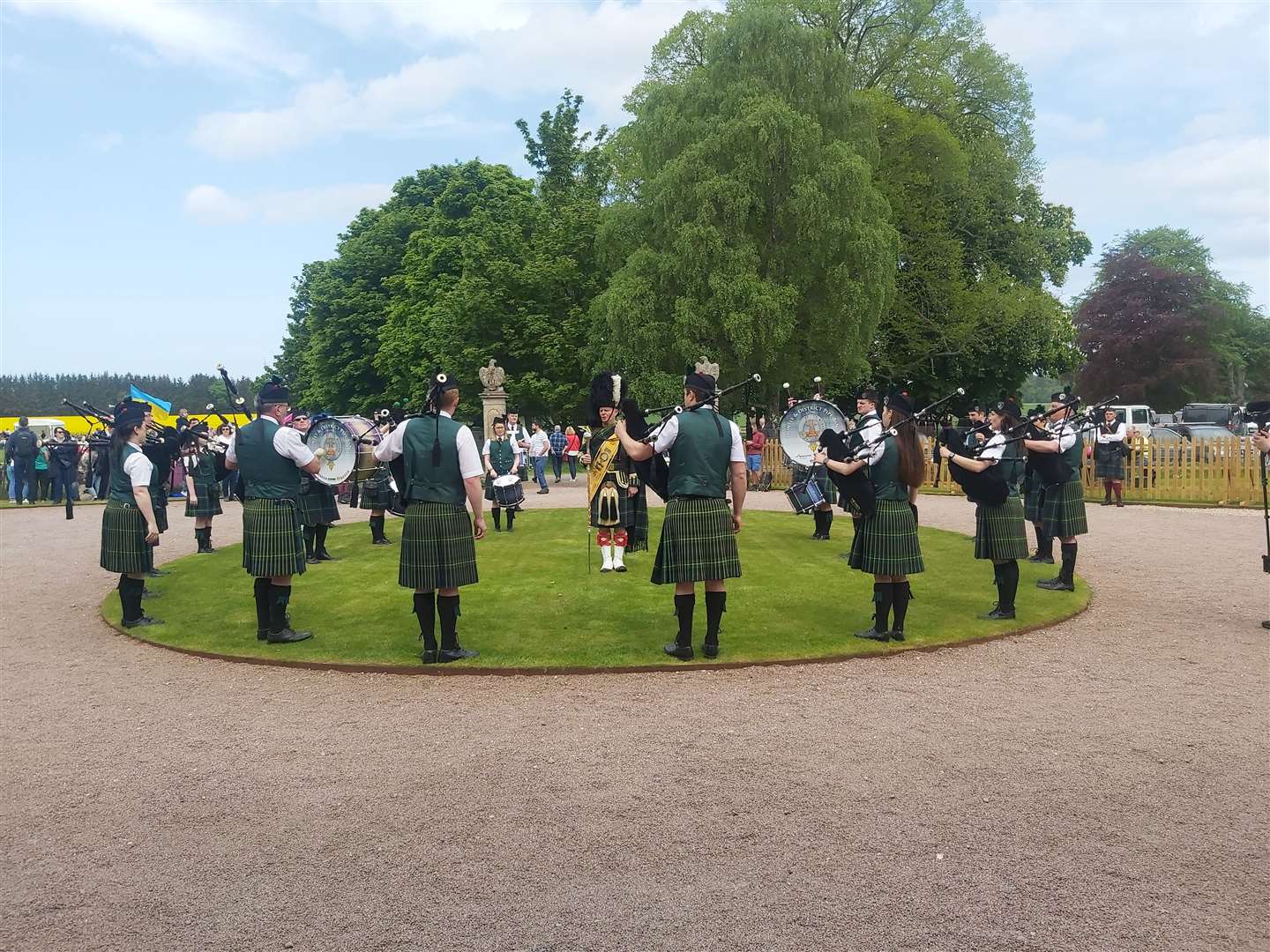 Huntly and District Pipe Band perform on the lawn at Gordon Castle.