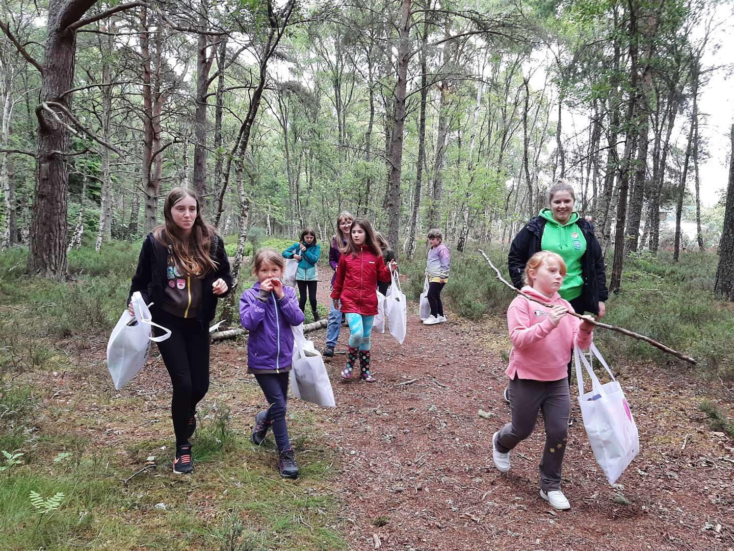 1st Cullen and 2nd Fochabers Brownies enjoy a trail in the forest.