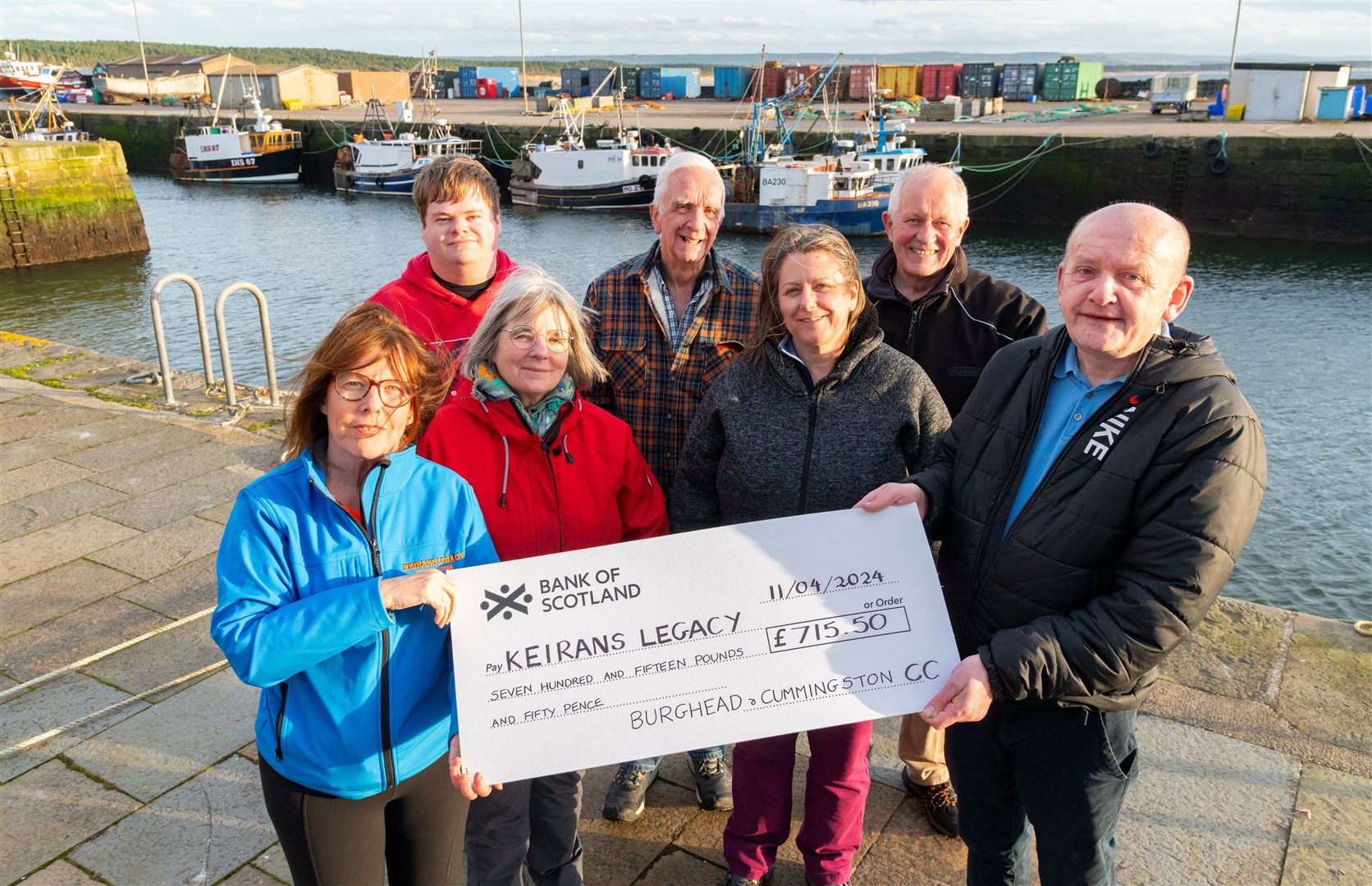 Members of the Burghead and Cummingston Community Council hand over a cheque to Sandra McKandie from Keirans Legacy for £715.50. Picture: Beth Taylor
