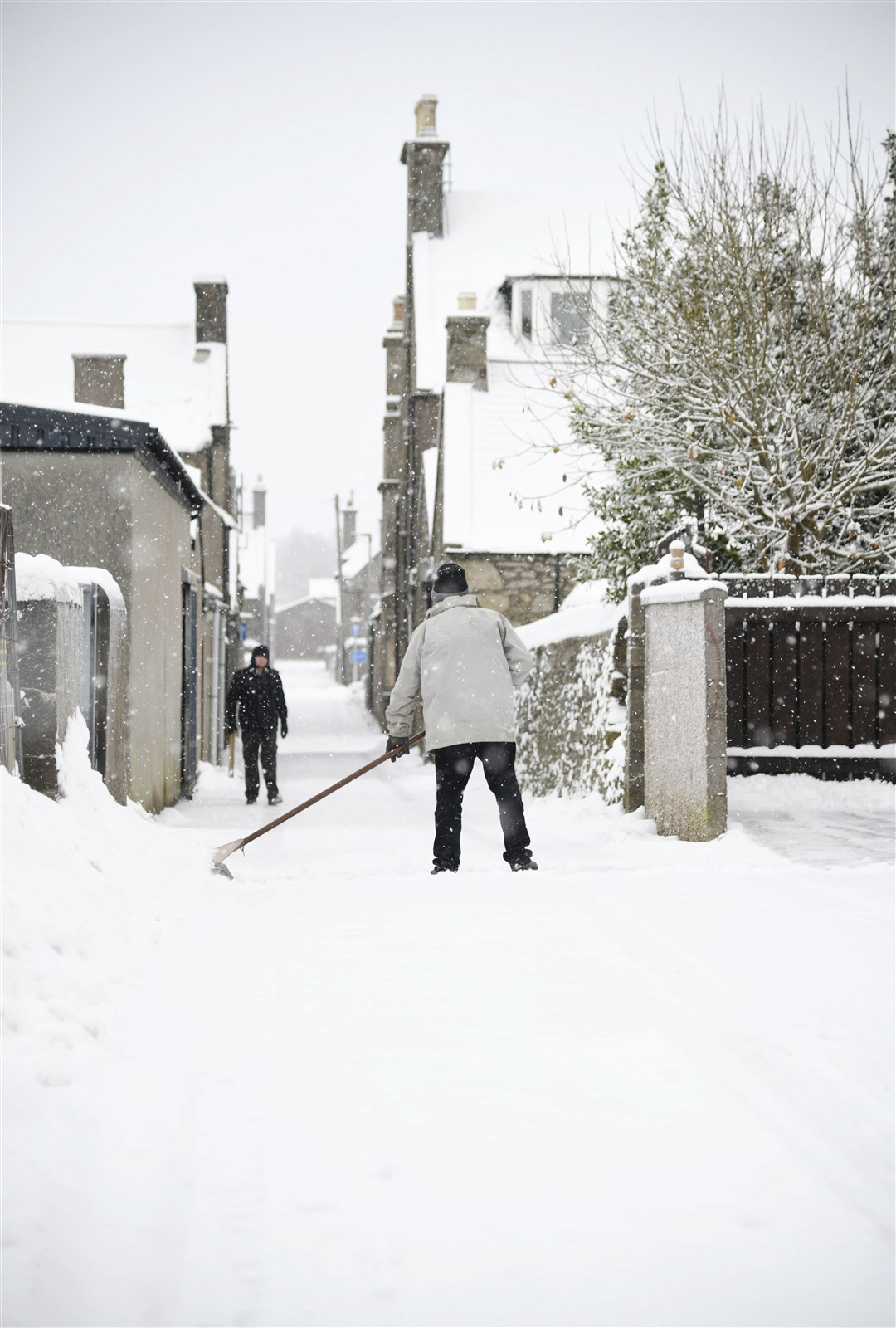 A local shoveling the snow off his drive in Keith...Picture: Beth Taylor...