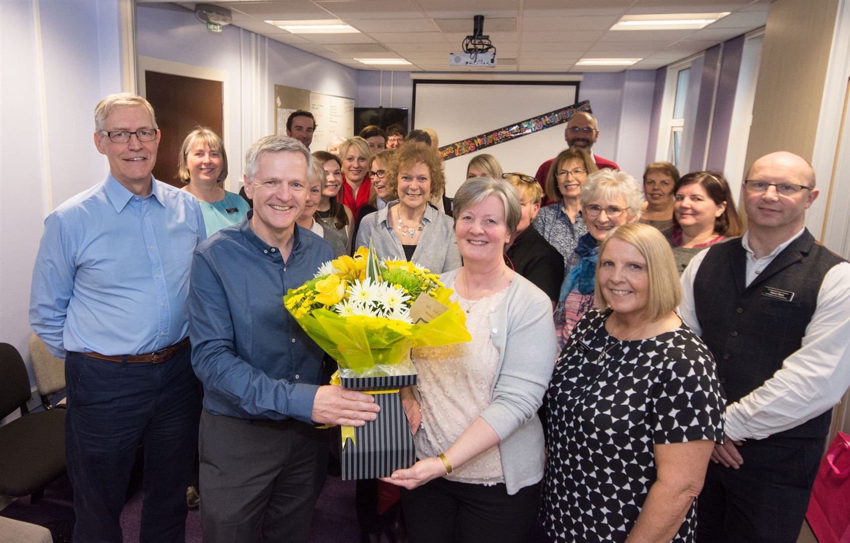 Dr Elizabeth Albiston (front centre) was joined by current and former colleagues for a retirement celebration at Maryhill Heath Centre. Picture: Becky Saunderson. Image No.043633.