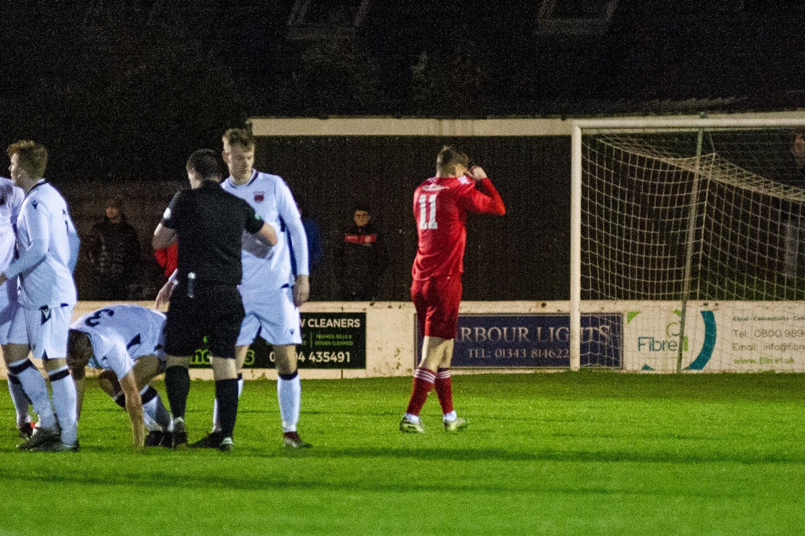 Lossiemouth FC forward Ross Elliot is sent for an early shower by referee Lee Robertson.