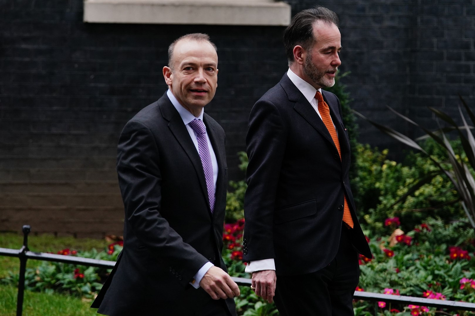 Chris Pincher, right, with chief whip Chris Heaton-Harris leaving Downing Street following their appointment in February (Aaron Chown/PA)