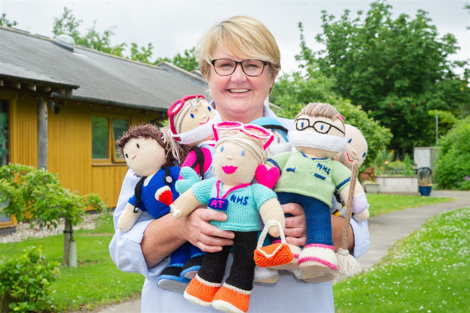 Karyn Sim,who works at The Oaks, has been busy knitting dolls of her fellow members of staff to raise money for the gardens at the care unit...Picture: Daniel Forsyth..