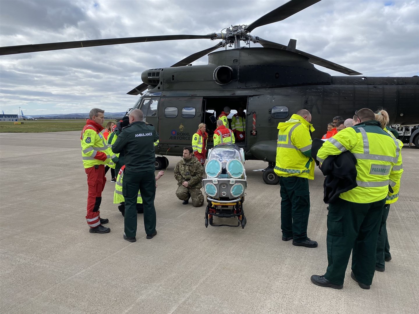 Puma crews work with Paramedics and Doctors from the Scottish Ambulance Service and NHS Scotland to understand best practice in how the Puma helicopter can support their life-saving efforts when using the new EpiShuttle isolation stretcher...RAF Puma helicopters based at Kinloss Barracks in Moray have been supporting the Scottish Ambulance Service with the trials of the EpiShuttle medical isolation and transportation system as part of the Scottish Government’s coronavirus response..