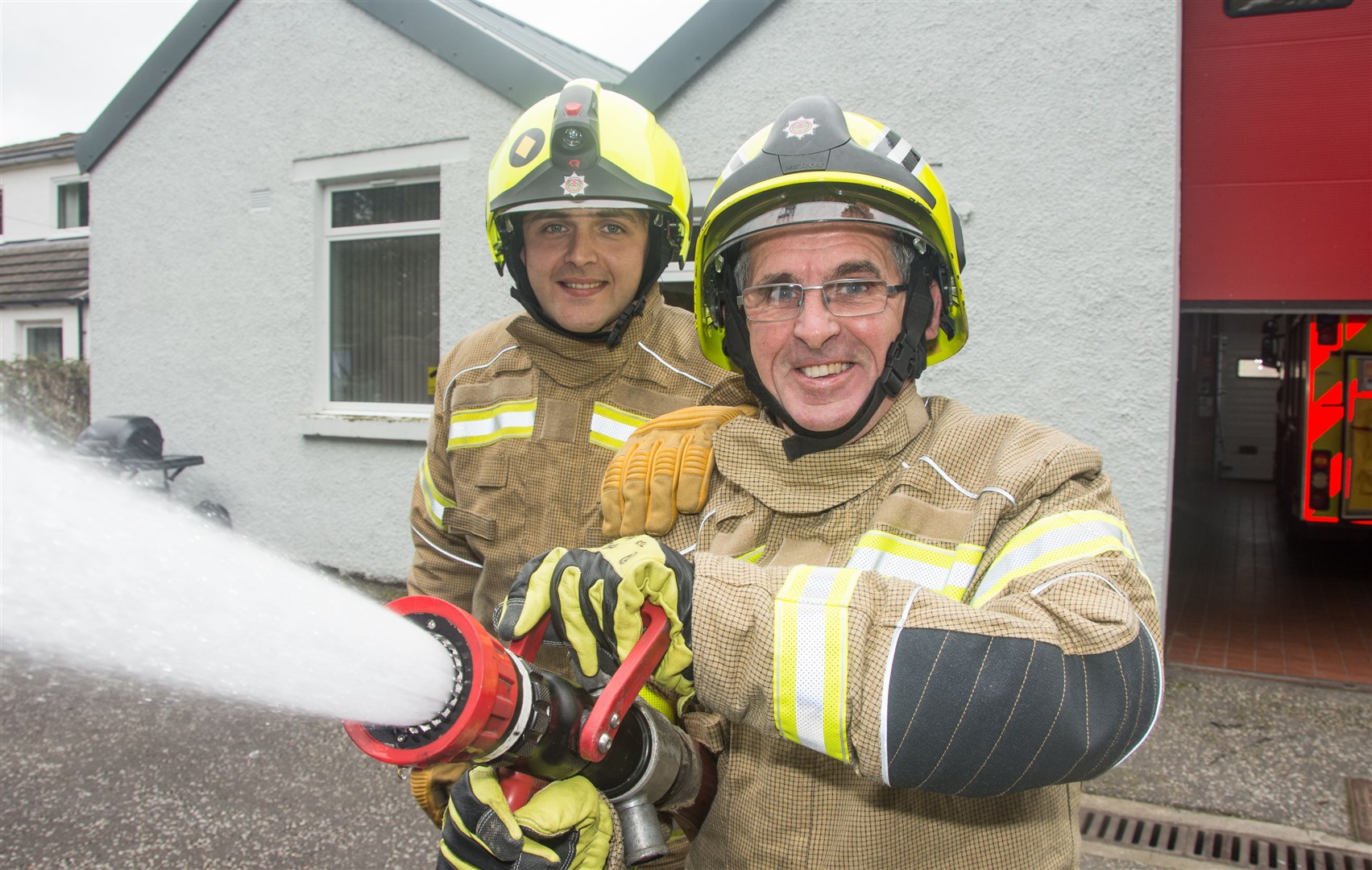 Fochabers fire station new recruit Jos Smith (back) with dad Gary who has been there 42 years...Fochabers Fire Station Recruitment Drive...Picture: Becky Saunderson. Image No.044678.