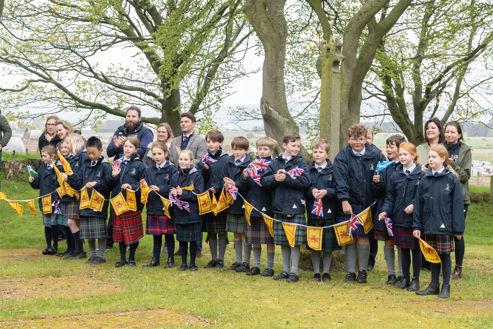 Pupils from Gordonstoun join together to watch the Junior school re-enact the King's Coronation. Picture: Beth Taylor