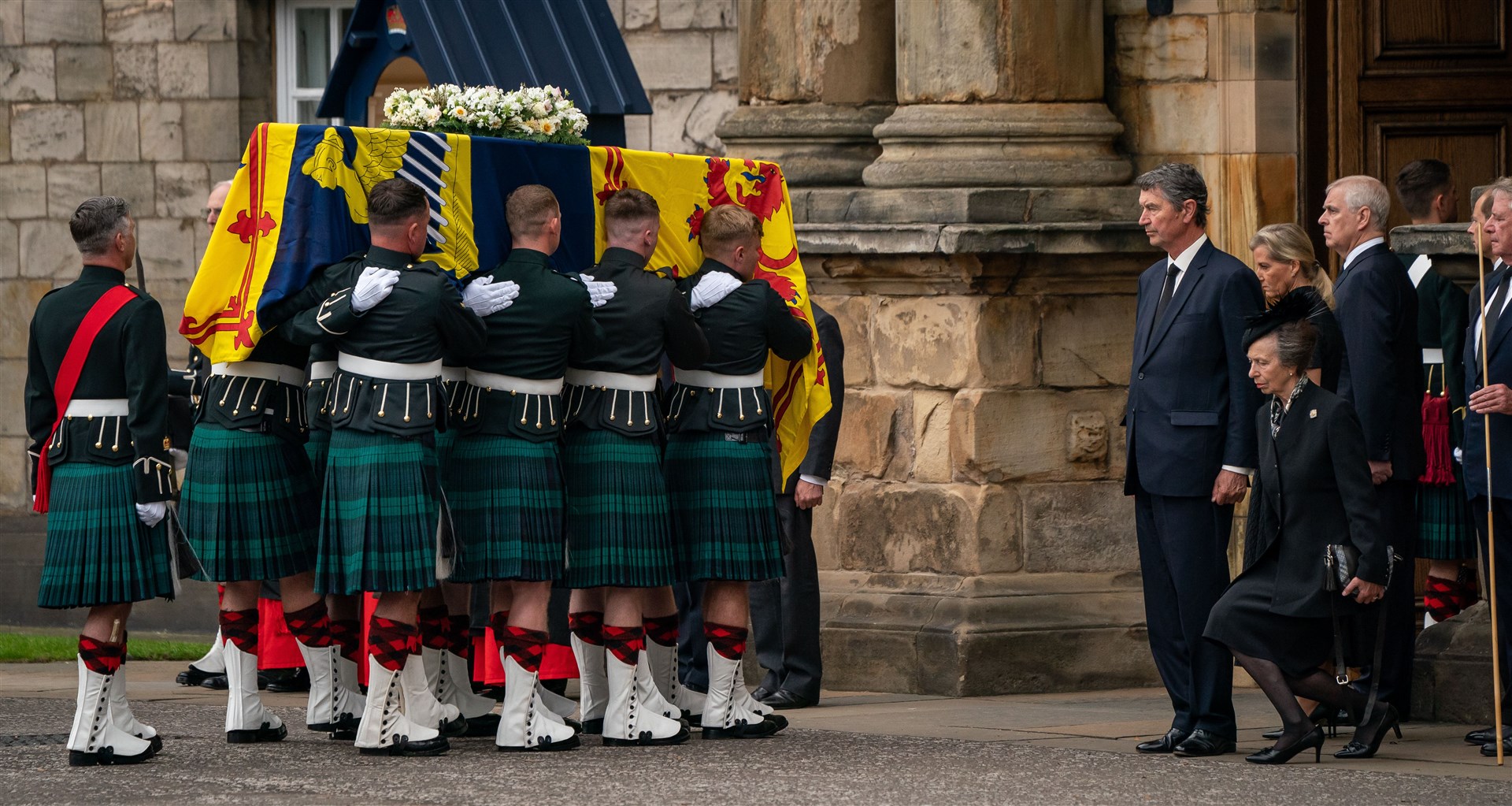 The Princess Royal curtseying as the Queen’s coffin arrives at Holyroodhouse (PA)