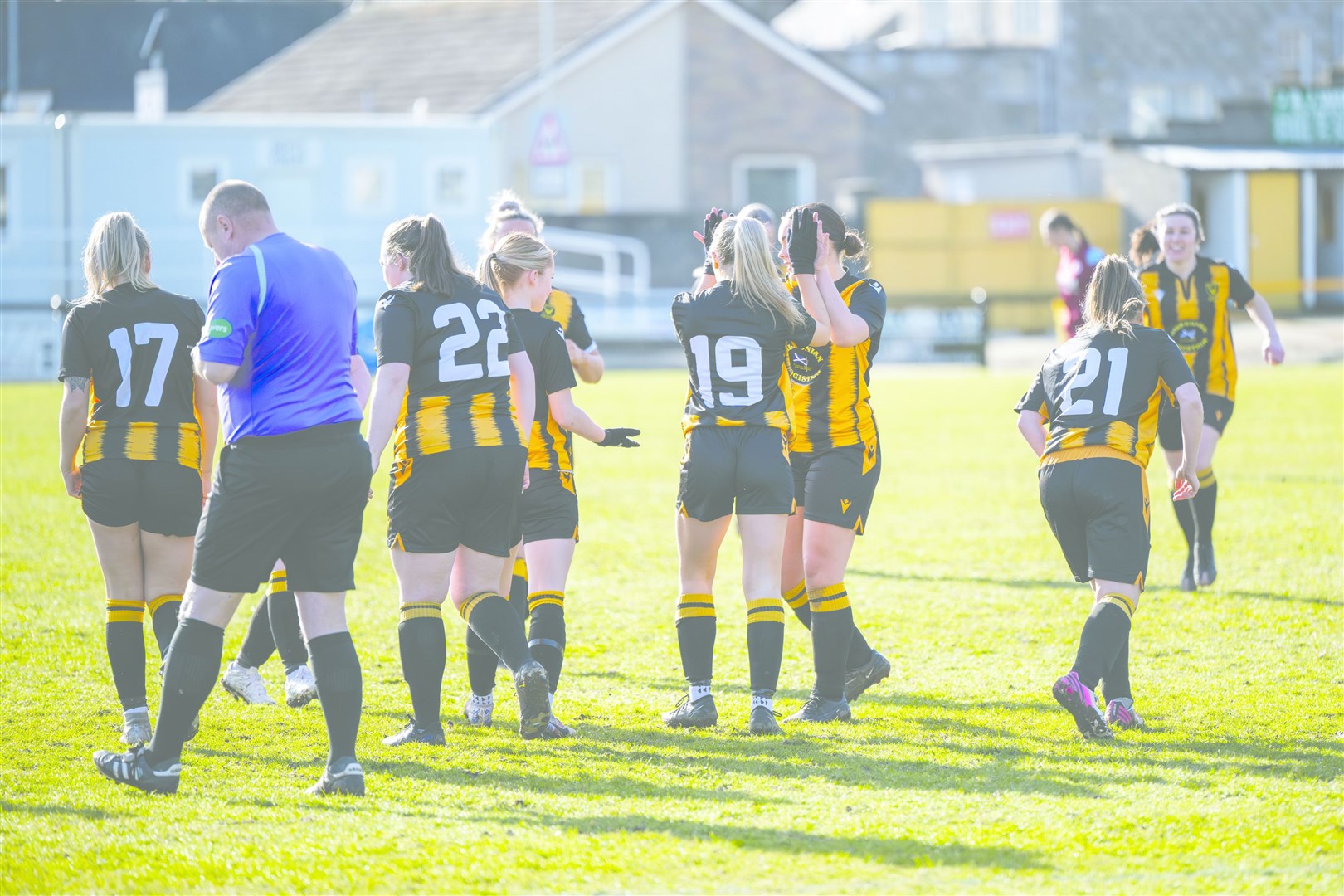 Jenna Laidlaw (number 19) is congratulated after opening the scoring inside 66 seconds for Huntly. Picture: Davie Henderson