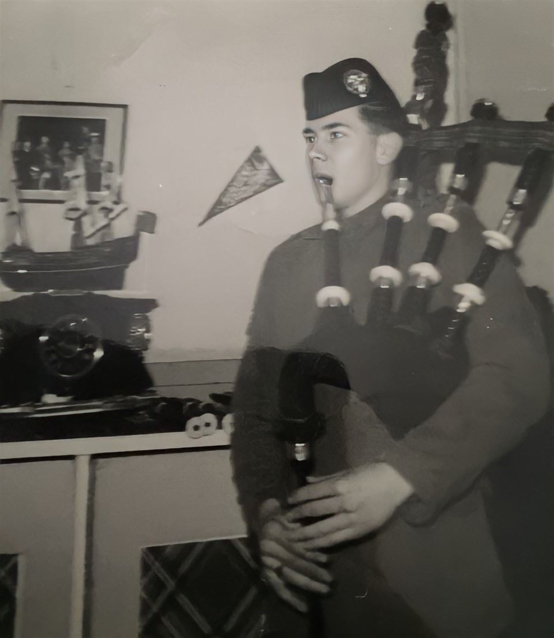 Pipe major James Riddell playing at home (PoppyScotland/PA)