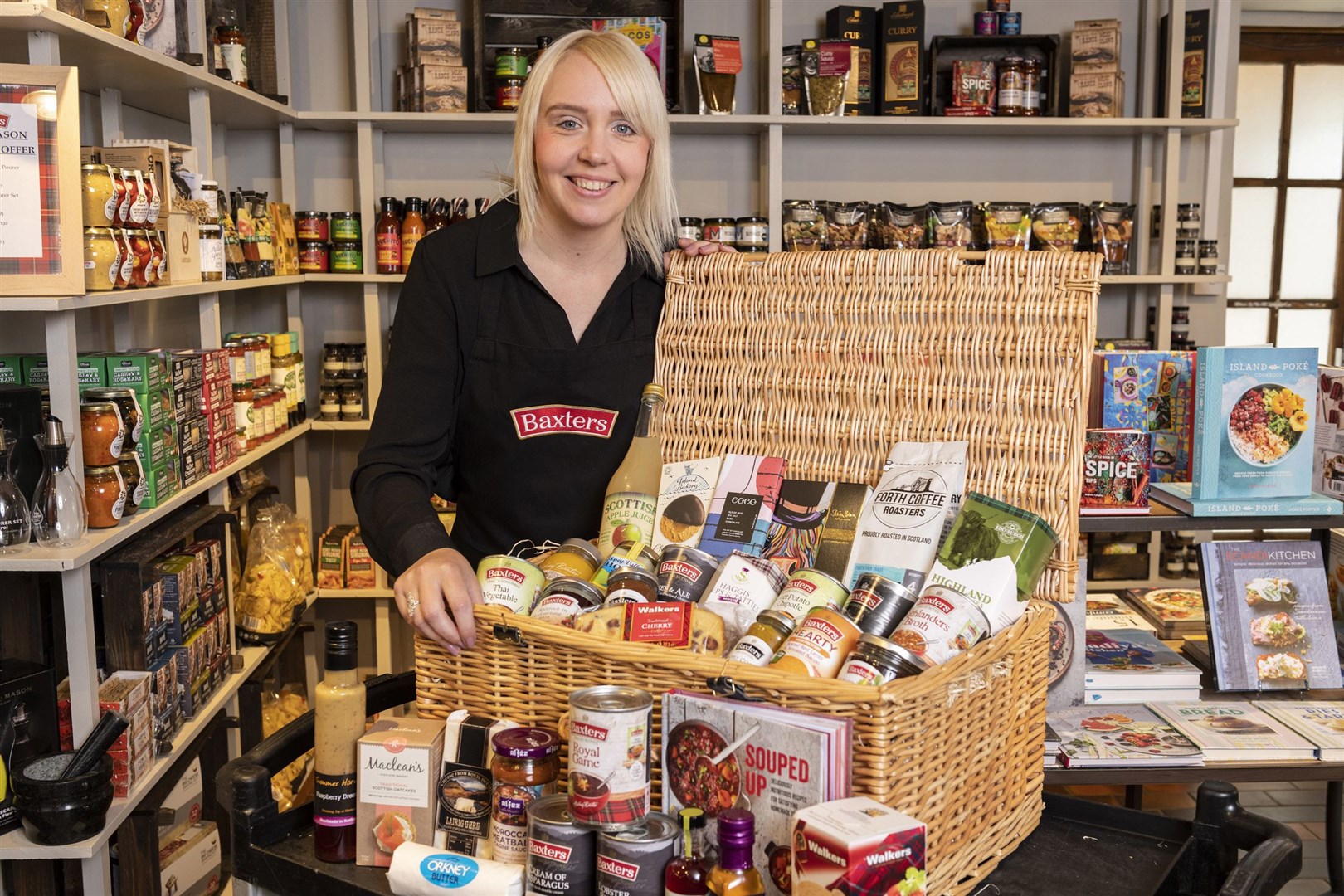 Heather Reekie from Baxters Highland Village with a hamper of Scottish produce from the store. Picture: John Paul