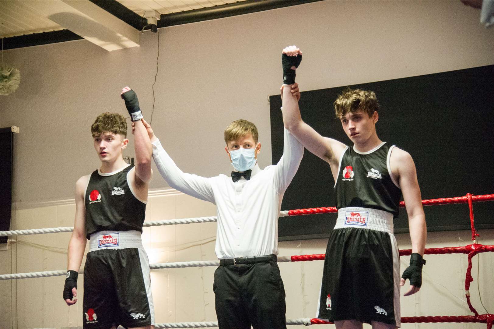Liam Shiels and Charlie Moody both get their hand raised after a thrilling exhibition bout. Picture: Becky Saunderson..