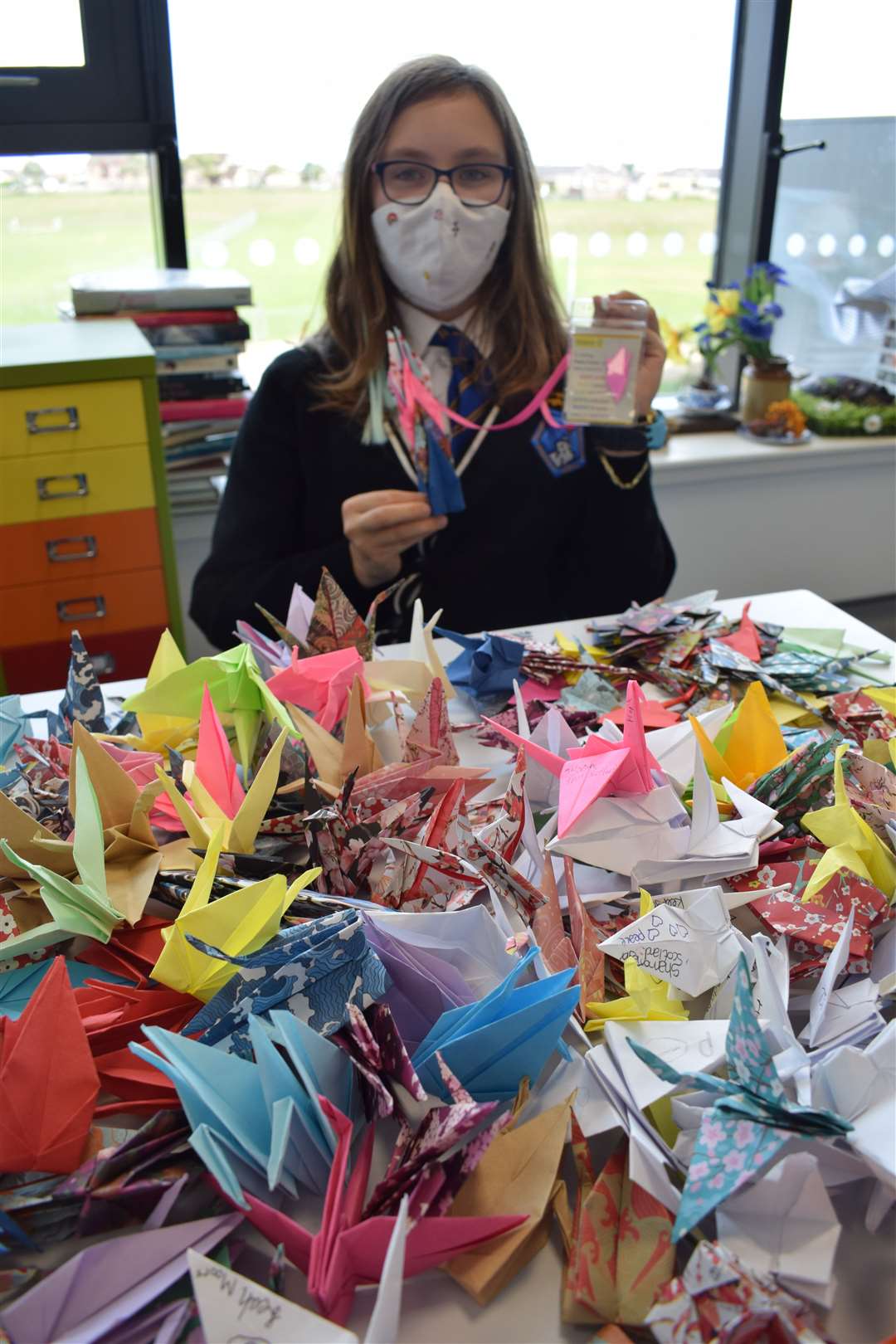 Lossiemouth High School pupil Ellie Rose Murray with some of the origami peace cranes.