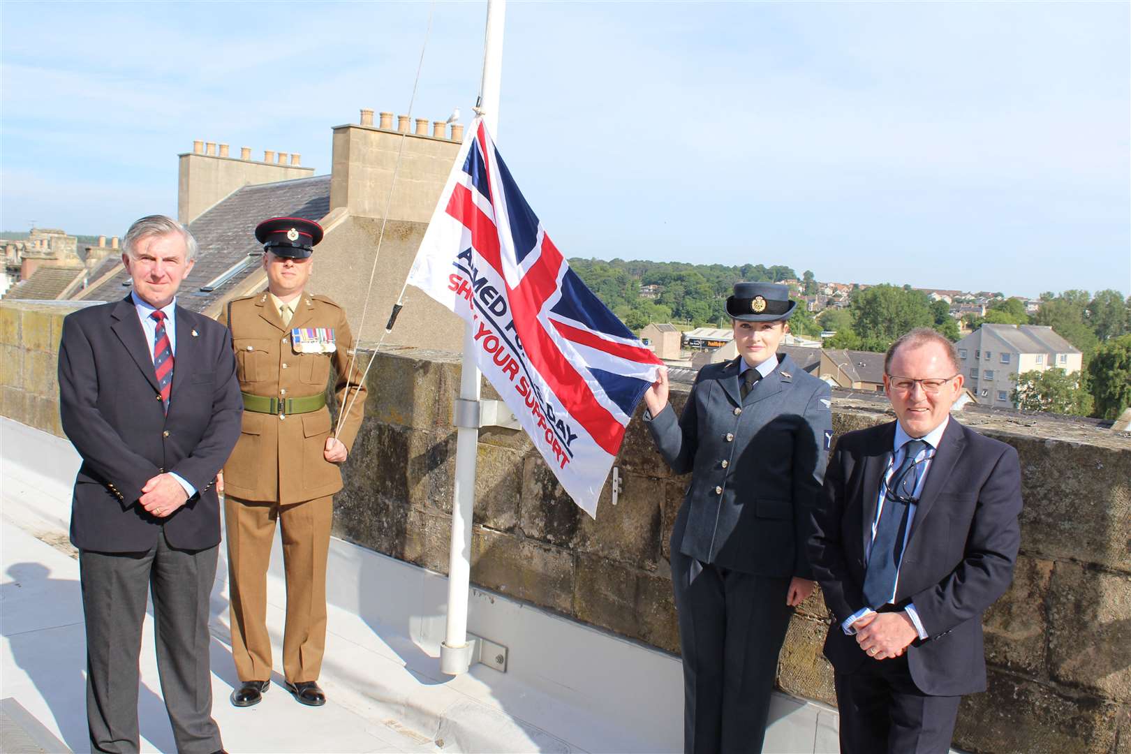 Moray Council’s Armed Forces Champion, Cllr Donald Gatt (left) – himself an RAF veteran – hoisted the flag above the council HQ in Elgin, assisted by Lance Corporal Robinson from 39 Engineer Regiment at Kinloss, SAC Katherine Audin from RAF Lossiemouth and Moray Council chief executive Roddy Burns