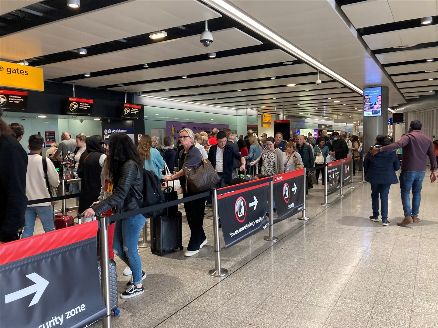 Passengers queue for flights at Heathrow Airport (Ben Smith/PA)