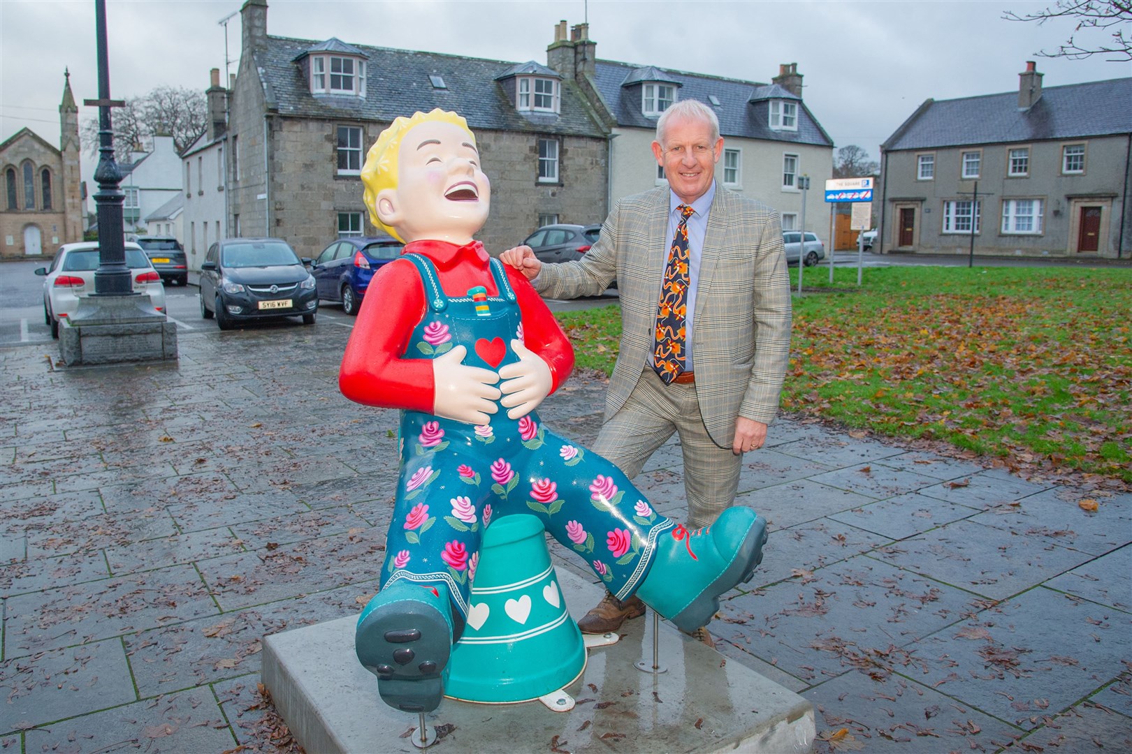 Gordon Christie with the Floo'er Wullie statue, now located in Fochabers Square. Picture: Daniel Forsyth.
