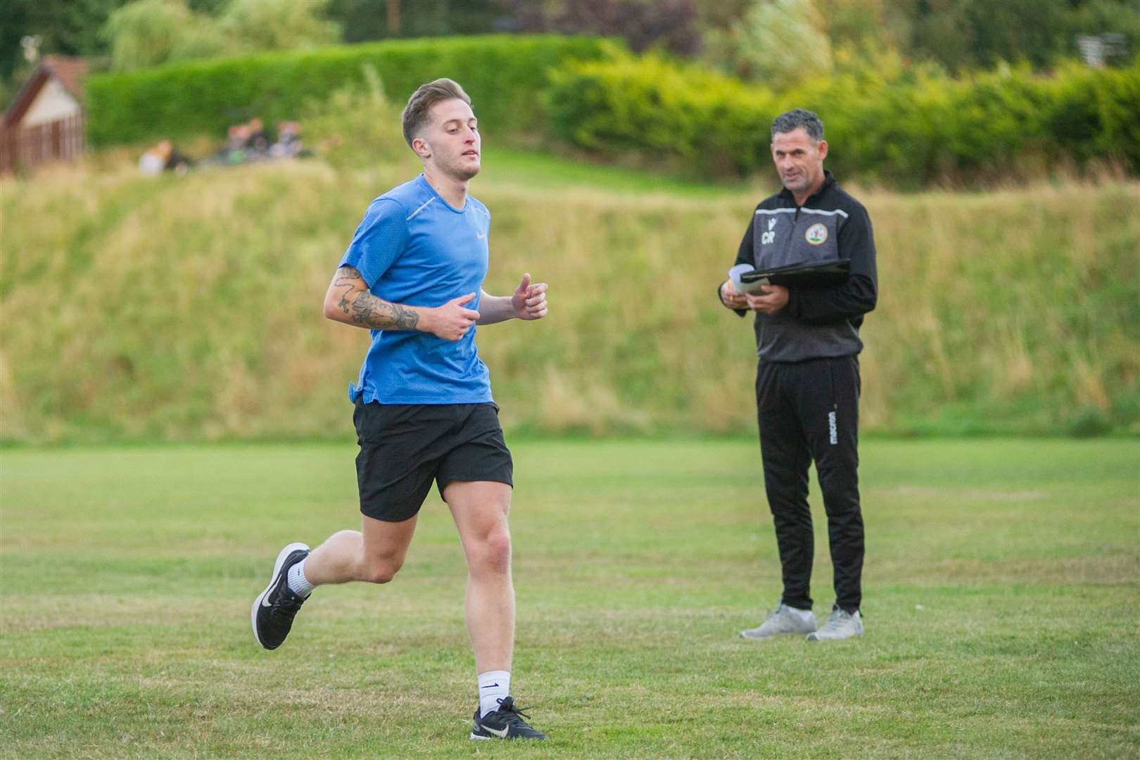 Forres Mechanics manager Charlie Rowley puts new signing Dale Wood through his paces at training. Picture: Daniel Forsyth..