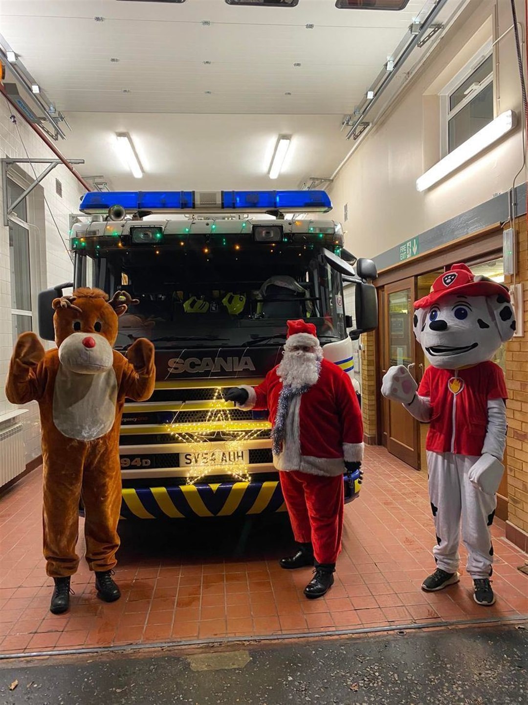 Rudolph, Santa and Marshall the fire dog get ready to hit the streets of Fochabers for last year's charity collection. Picture: Fochabers fire station