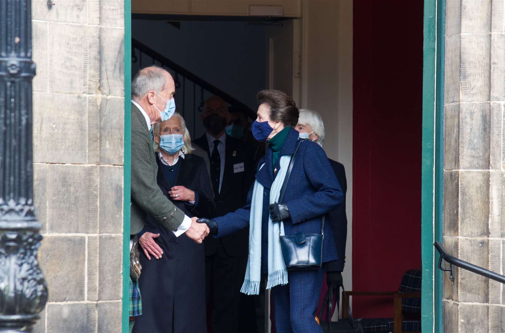 Princess Anne shakes hands with Forres councillor George Alexander as she leaves the Tolbooth. Picture: Becky Saunderson..
