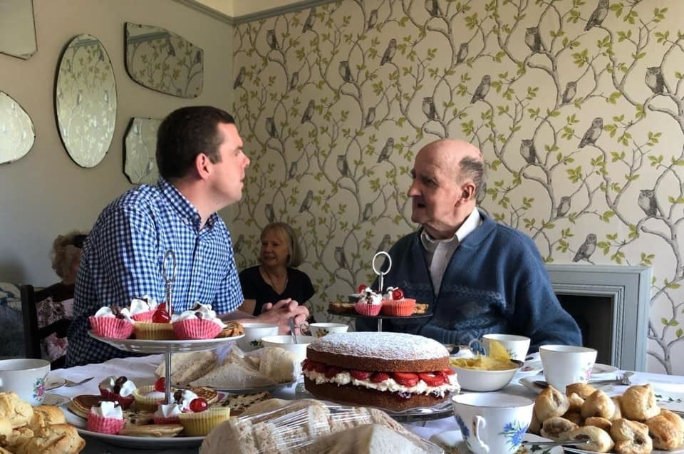 Moray MP Douglas Ross chats to guest Calum at the Elgin 2 group's tea party in Longmorn on Sunday.