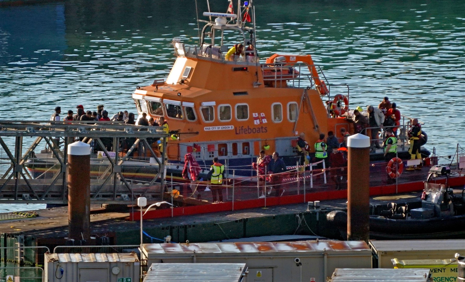 A group of people thought to be migrants are brought into Dover, Kent, onboard the Dover lifeboat following a small boat incident in the Channel (Gareth Fuller/PA)