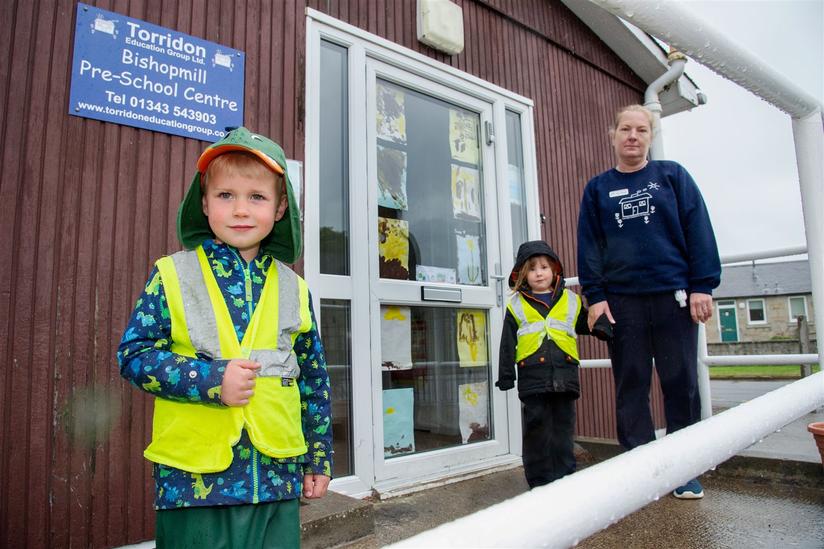 Oscar Last, Olivia Hainey and Kelly Woollett, manager at Bishopmill Pre-School Nursery, after an attempted break-in left the door damaged. Picture: Daniel Forsyth.